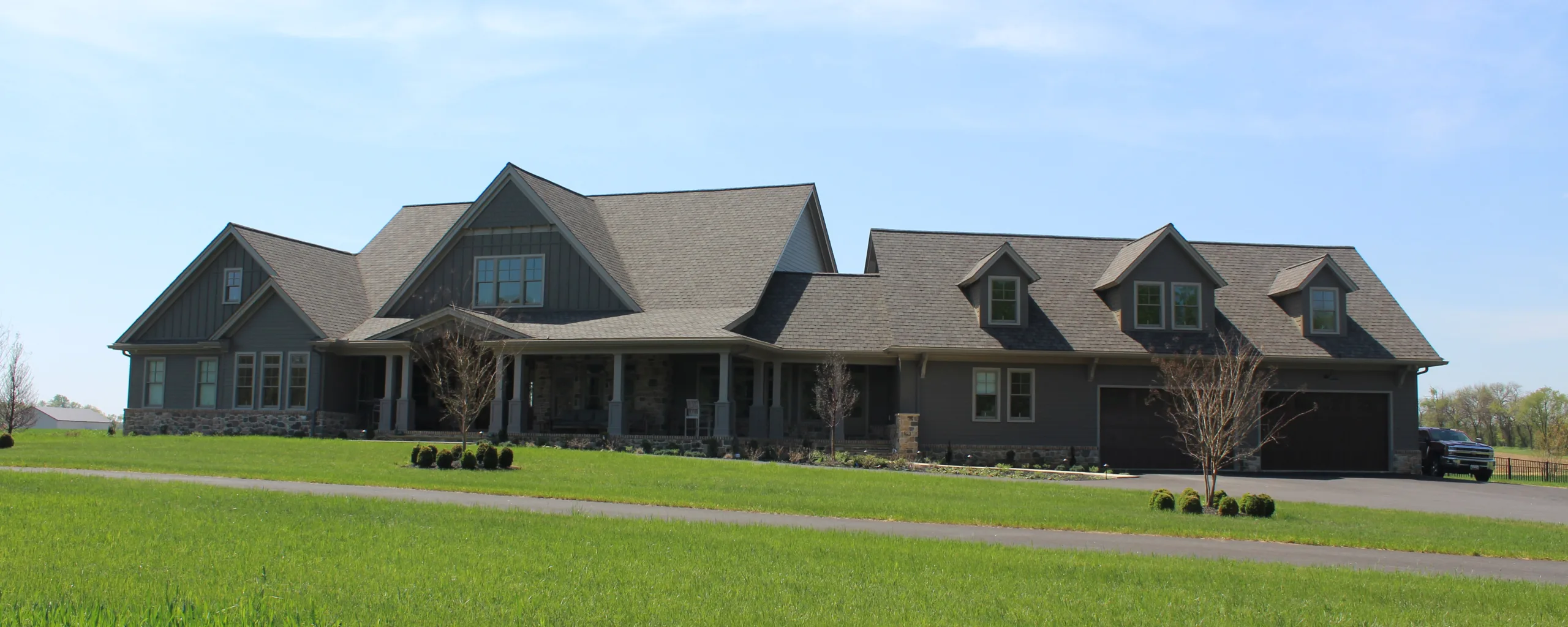 A large home with a large driveway.